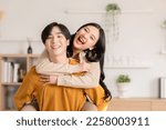 Asian young couple hugging with ...
