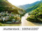 Small photo of New edited version - Confluence of two rivers Alaknanda and Bhagirathi give rise to the holy river of Ganga / Ganges at one of the five Prayags called Dev Prayag. Uttarakhand river. Sunrise & greenery