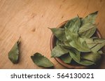bay leaf on a wooden surface. Top view/spices of bay leaf in rural style. Top view