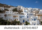 Small photo of Cyclades, Greece. Tinos Greek island, Pyrgos village white color buildings uphill, blue sky