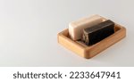Small photo of Handmade organic soap, salty, tarry, on a white background, banner, place for text