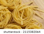 italian uncooked tagliatelle... | Shutterstock . vector #2115382064