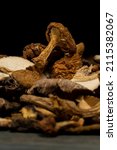 mix dried mushrooms on black... | Shutterstock . vector #2115382067