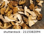 mix dried mushrooms on wooden... | Shutterstock . vector #2115382094