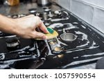washing of gas cooker from glass ceramics. black hob.