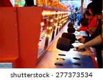 Small photo of Coquitlam, BC, Canada - April 09, 2015 : People playing whack game at carnival