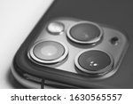 Phone with a triple camera isolated on white background