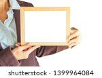 blank wooden photo frame in the ... | Shutterstock . vector #1399964084