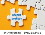 Become a sponsor message on a puzzle piece apart form the assembled pieces. Financial sponsorship support or charity donation concept.