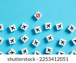Flight cancellation, restriction or sanctions. Closing air routes. No-fly zone. Ban on flights. Closure of state borders. Cancelled sign and airplane symbols on white blocks.