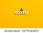 Small photo of White letter blocks on yellow background with the word theory. Theoretical knowledge, principles and ideas in education concept.