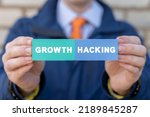 Businessman holding colorful styrofoam blocks with growth hacking inscription. Growth Hacking Business Marketing Concept. 