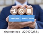 Small photo of Businessman or politician holding colorful blocks with icons and inscription: SANCTIONS AGAINST RUSSIA. Sanctions concept. Political and economic measures of deterrence countries. Embargo government.