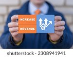Small photo of Man holding colorful blocks with icons and inscription: INCREASE REVENUE. Concept of growth hacking and increase revenue marketing business technology. Increase number of users and revenues.