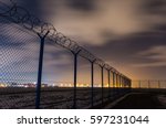 Fence with barbed wire, restricted area