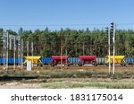 Small photo of WAGONS WITH CRUSHED STONE - Color railway on the sidetrack