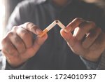 Man refusing cigarettes concept for quitting smoking and healthy lifestyle dark  background. or No smoking campaign Concept.	
