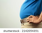 Fat man has excess fat, he is dieting and losing weight.
