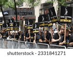 Small photo of NEW YORK, NEW YORK-JULY 14, 2022: People join the picket line in front of NBC Studios in Midtown Manhattan, as 160,000 members of SAG-AFTRA went on strike today.