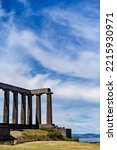 The National Monument on Calton Hill against blue sky. Edinburgh, Scotland.