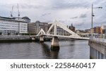 Small photo of GLASGOW, UK - JUNE, 2022: The Tradeston Bridge (Tredstoun) known as the Squiggly bridge, a pedestrian footbridge across the River Clyde at day time, Scotland.