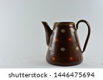 Small photo of Hillegom, Netherlands - July 05 2019: Coffee/Tea pot made from unused grenades.Germany 1945 after the war.Brown enamel.