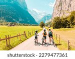 Family riding on mountain bike in Switzerland