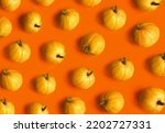 Pumpkin pattern. Flat lay, top view. Halloween, thanksgiving day, autumn theme. Abstract background. Minimalistic fall vegetables concept