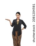 Small photo of beautiful woman wearing traditional Javanese clothes presenting