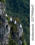 Small photo of The Temple Stupas of the Wat Phra Bat Phu Pha Daeng in the Landscape north of the City of Lampang in the Province of Lampang in North Thailand. Thailand, Lampang, November, 2016