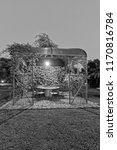 Small photo of Italy, Sicily, gazebo in the garden of a farm house in the countryside at sunset
