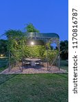 Small photo of Italy, Sicily, gazebo in the garden of a farm house in the countryside at sunset