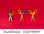 three colourful scissors on the ... | Shutterstock . vector #1310749097