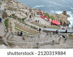 Small photo of Porthcurno, UK - August 2018: The Minack Theatre is an open-air theatre with a rocky granite outcrop, jutting into the sea