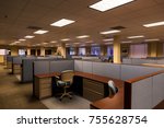 Small photo of An empty office space with furnished cubicles ready to be occupied.