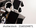 Old computers, digital tablets, mobile phones, many used electronic gadgets devices, broken household and appliances on white background. Planned obsolescence, electronic waste for recycling concept