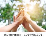 Small photo of Four hand up of people working assemble corporate meeting show symbol Join forces teamwork quality and effective personnel Concept organizational development in teamwork and business