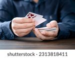 Small photo of Shuffle the cards gambling poker cards in casino and casino chips poker table game business gambling concept