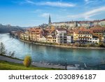 Bern city Skyline with Aare river and Bern Minster Cathedral tower on background - Bern, Switzerland