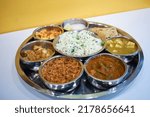 Indian food. Rajasthani Thali. Veg Full main course meal India. Maharaja Thaali. Veg Thali from an indian cuisine. Marwadi Dishes. Indian Traditional Thali Food. 