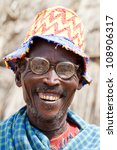 Small photo of OMO VALLEY, ETHIOPIA - AUG 16: Elder Dasanech ethnicity smiling,the ethnic groups in the Omo valley Could disappear Because of Gibe III hydroelectric dam on Aug 16, 2011 in Omo Valley, Ethiopia.