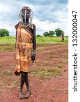 Small photo of ETHIOPIA - AUG 11: Joung Mursi posing in the village,the ethnic groups in the The Omo valley Could disappear Because of Gibe III hydroelectric on dam.Aug 11, 2011 in Omo Valley, Ethiopia.