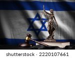 Small photo of Israel flag with statue of lady justice, constitution and judge hammer on black drapery. Concept of judgement and punishment