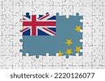 Small photo of Tuvalu flag in frame of white puzzle pieces with missing central parts
