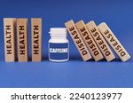 Medical concept. On a blue background, wooden plates with the inscription health and disease, in the middle a white jar with the inscription - Caffeine