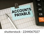 Small photo of Business concept. On financial reports lies a calculator, a pen and a sticker with the inscription - Accounts Payable