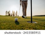 Small photo of green, golf, ball, club, course, golfer, grass, sport, golfing, fairway. blurred golfer putting ball on the green golf, lens flare on sunset evening time. Golfer putting golf ball near the hole.