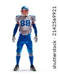 Small photo of Brutal an American football player stands in white background. Isolated on white. Sports emotions