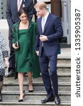 Small photo of LONDON, UK - March 11: Meghan Markle and Prince Harry receive flowers after leaving Canada House on the March 11, 2019 in London, UK