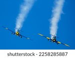 Small photo of Madrid, Spain- February 5, 2023: Air show of vintage airplanes over the sky of Madrid. Planes in acrobatic formation model Yack 52. old planes